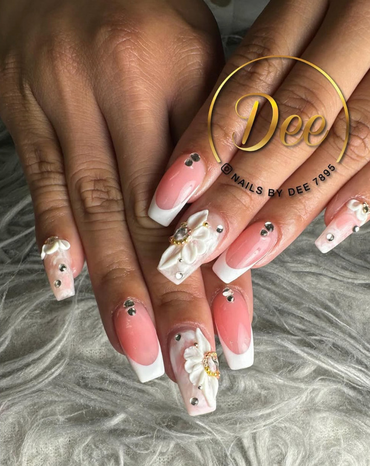 Pink French tip and floral nail design by Nails by Dee